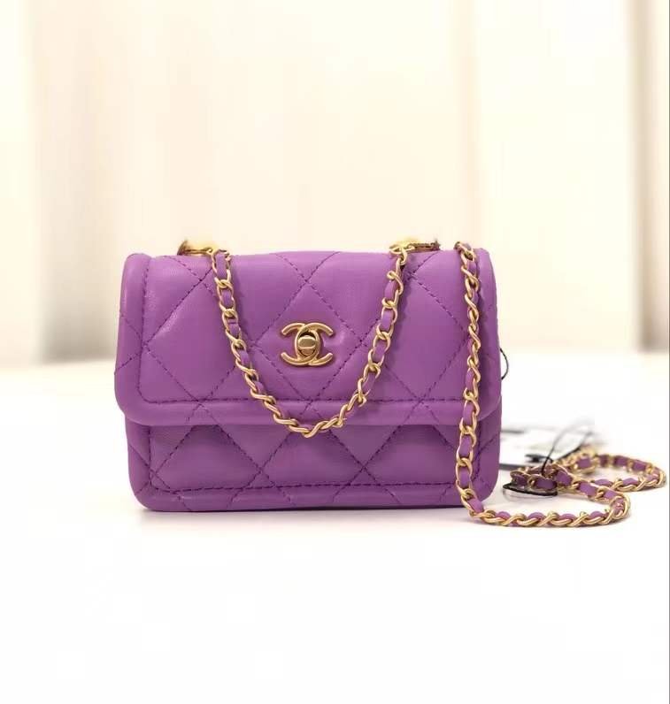 button on top , purple leather with flap bag
