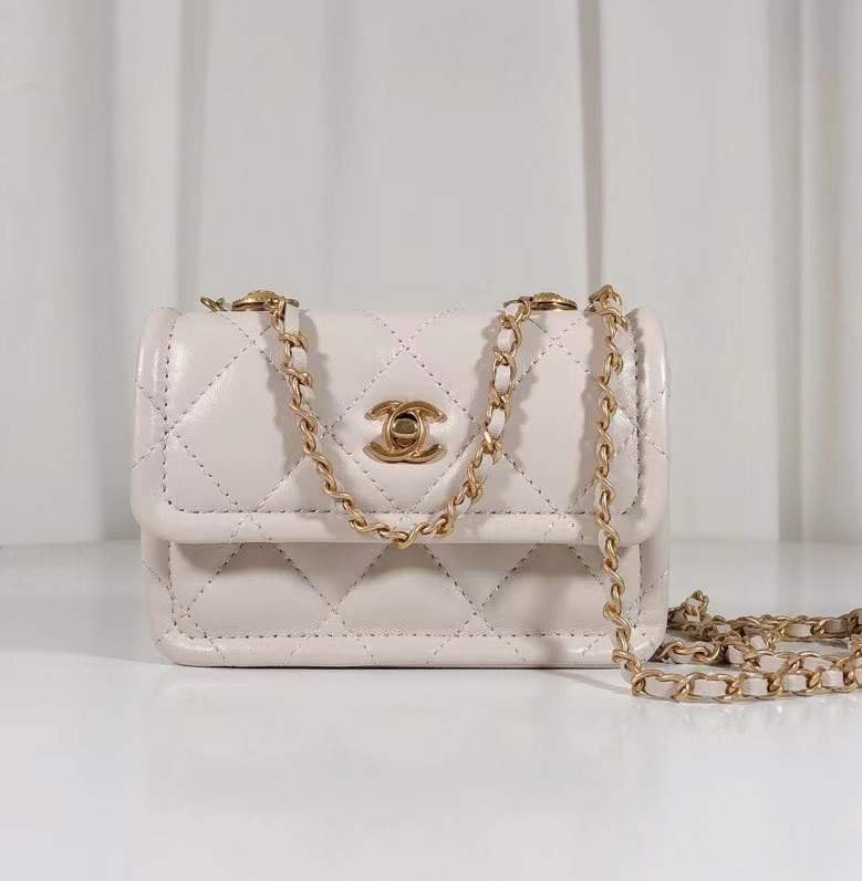 button on top , white leather with flap bag