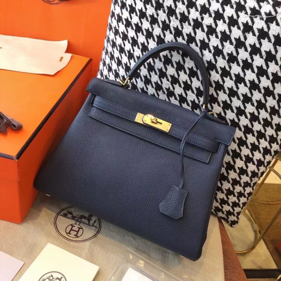 Kelly , black leather with gold hardware