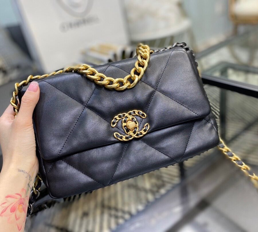 Chanel 19 , black leather with gold hardware